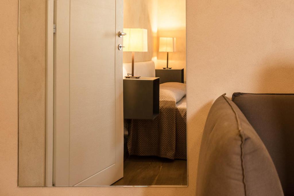 Posteľ alebo postele v izbe v ubytovaní Lazise Boutique Apartment Lago e Relax
