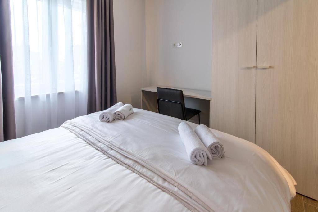 Posteľ alebo postele v izbe v ubytovaní CURICTA Design Apartments