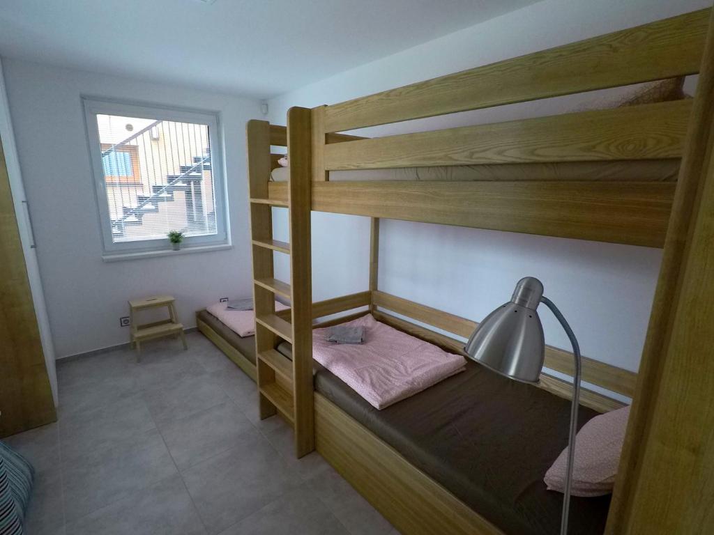 Łóżko lub łóżka w pokoju w obiekcie Lipno Vision Apartments