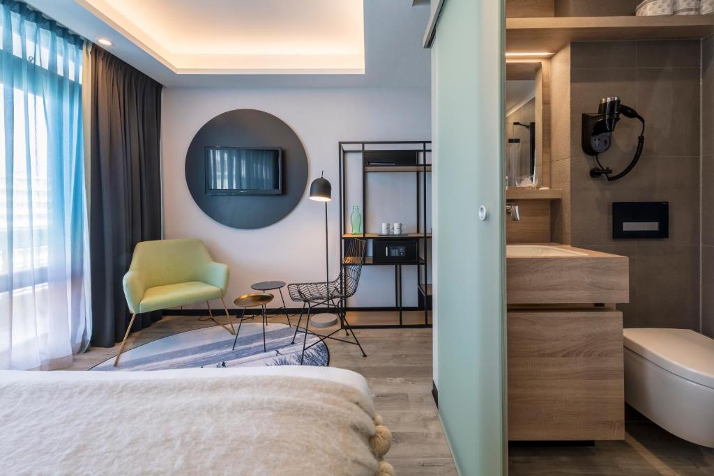 Postel nebo postele na pokoji v ubytování Palace Hotel Zandvoort