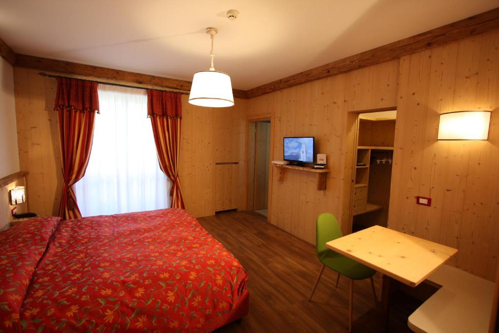 Postel nebo postele na pokoji v ubytování Hotel Trieste