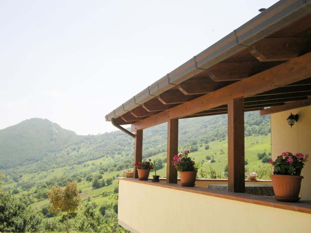 a view from the balcony of a house with potted plants at Residence Amici del Sorriso in Villa Celiera