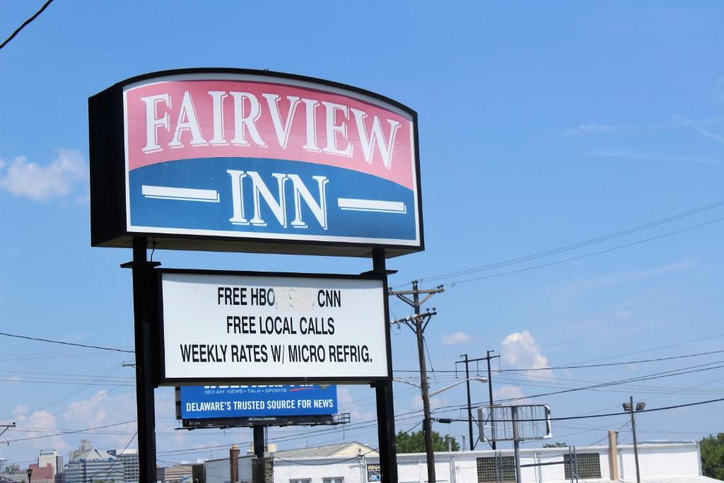 a sign for a farmeway inn on a street at Fairview Inn Wilmington in Wilmington