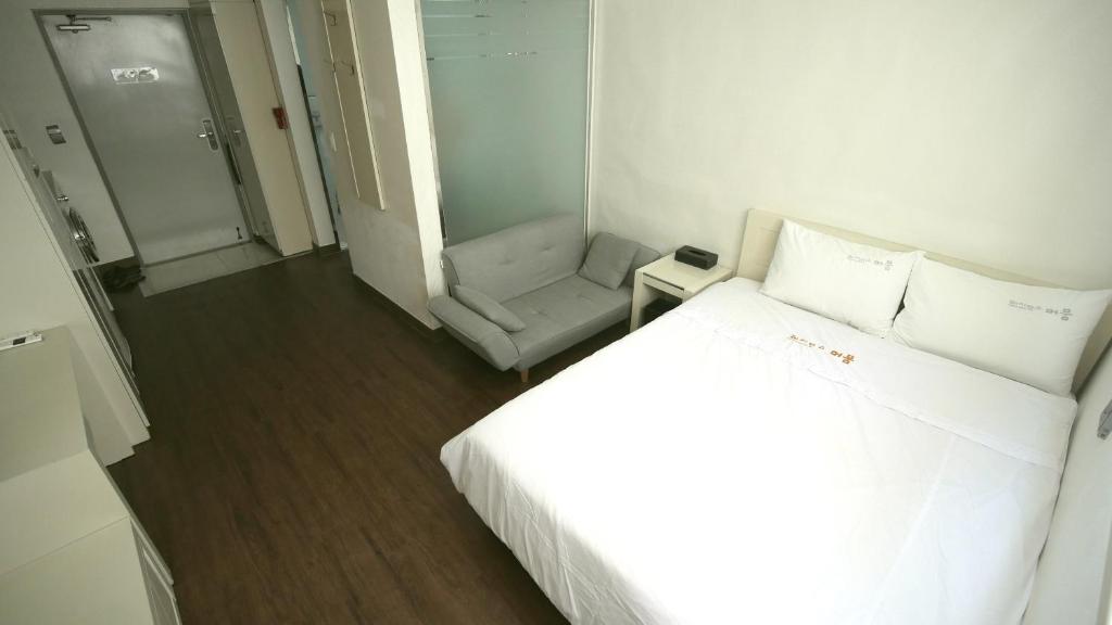 Postel nebo postele na pokoji v ubytování Residence Mumum Hotel