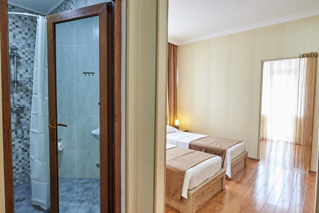 Voodi või voodid majutusasutuse Hotel Old Borjomi toas