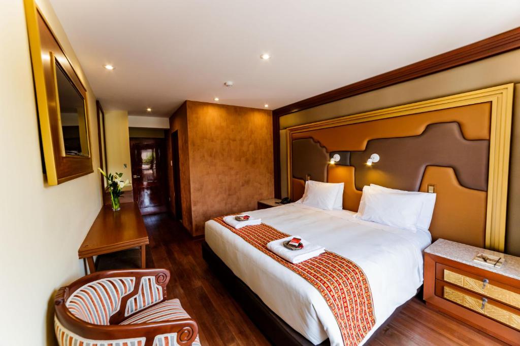 Cama o camas de una habitación en Yawar Inka Hotel