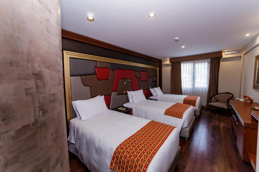 Cama o camas de una habitación en Yawar Inka Hotel