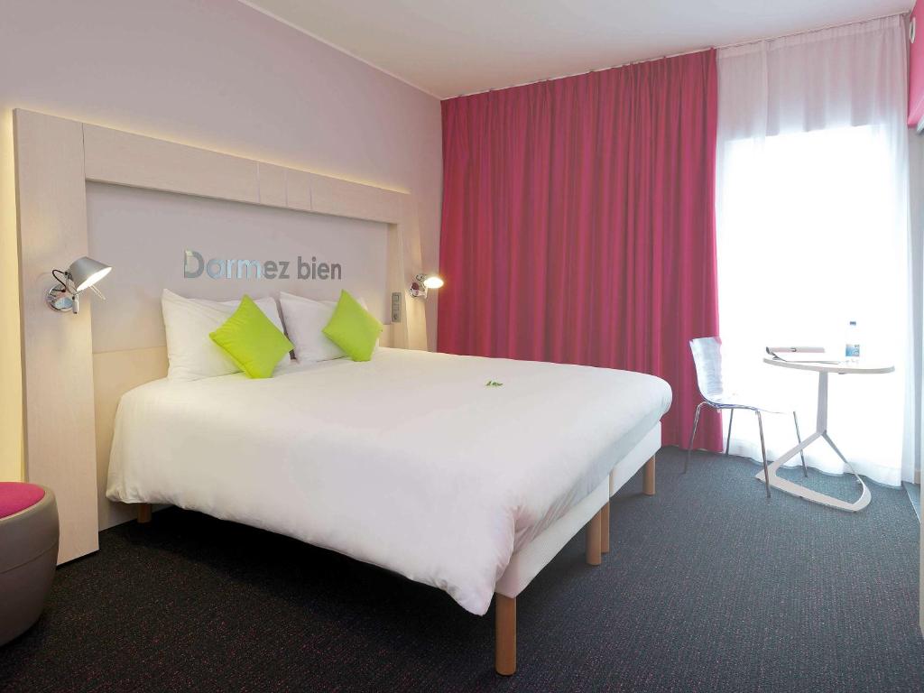 Postel nebo postele na pokoji v ubytování Ibis Styles Nivelles