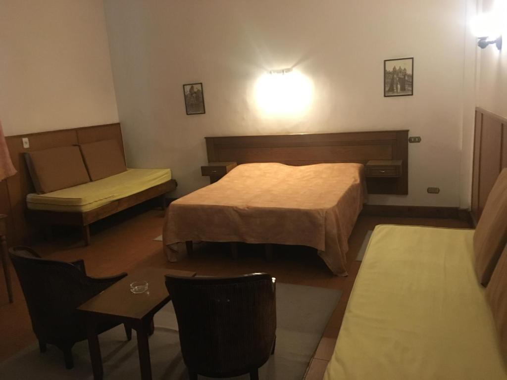 Кровать или кровати в номере Pension Roma