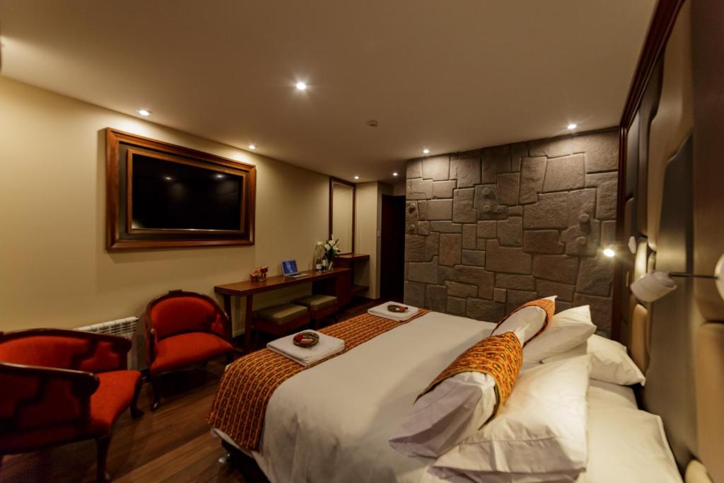 Cama o camas de una habitación en Yawar Inka Hotel
