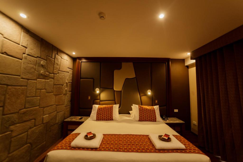 Cama o camas de una habitación en Yawar Inka Hotel