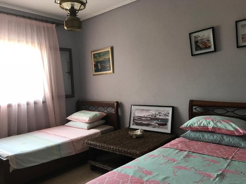 Postel nebo postele na pokoji v ubytování Loy Loy House