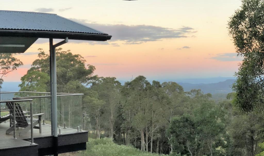 a house with a view of the forest at Tranquillity at Ravensbourne Escape in Ravensbourne