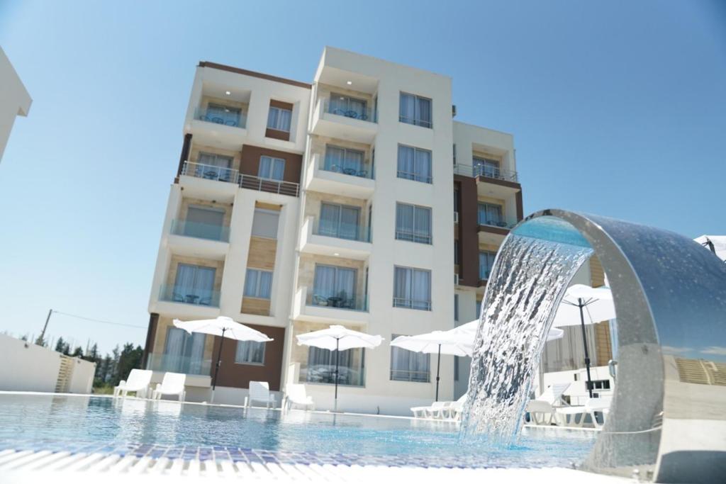 a water fountain in front of a building at La Dolce Vita Residence in Ulcinj