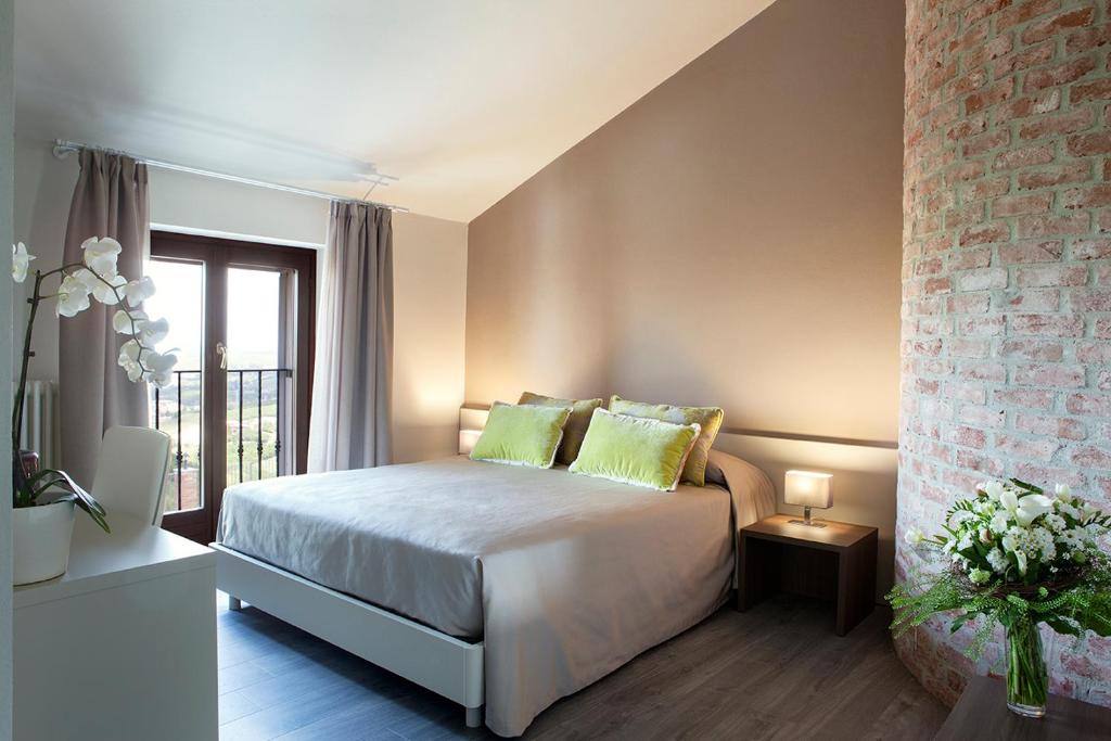 A bed or beds in a room at Locanda San Giorgio