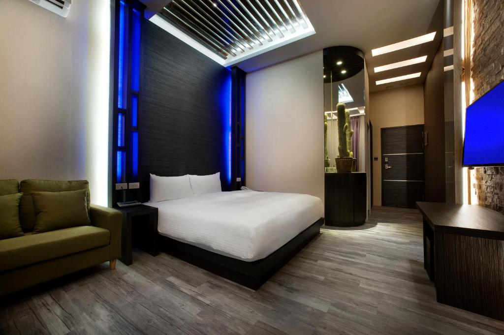 Postel nebo postele na pokoji v ubytování Two Fukun Hotel