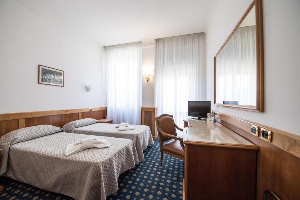 Postel nebo postele na pokoji v ubytování Quality Hotel Nova Domus