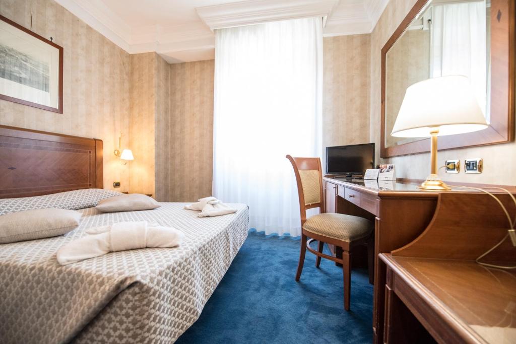 Postel nebo postele na pokoji v ubytování Quality Hotel Nova Domus