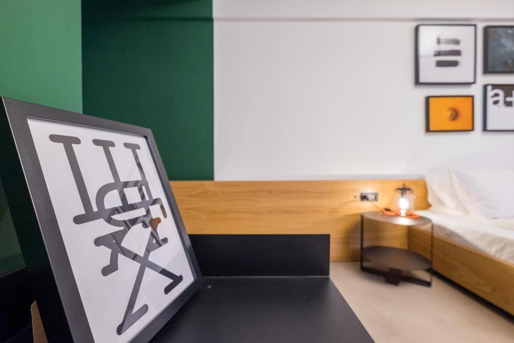 Postel nebo postele na pokoji v ubytování R34 Boutique Hotel