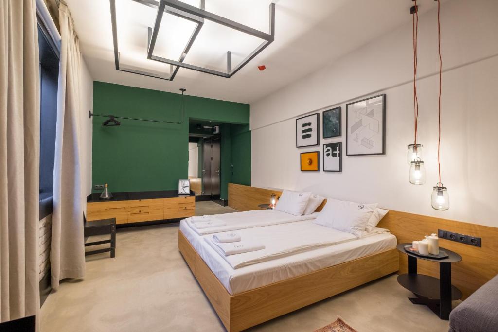 Postel nebo postele na pokoji v ubytování R34 Boutique Hotel