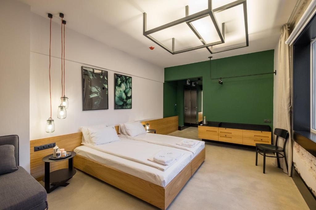 Postel nebo postele na pokoji v ubytování R34 Boutique Hotel