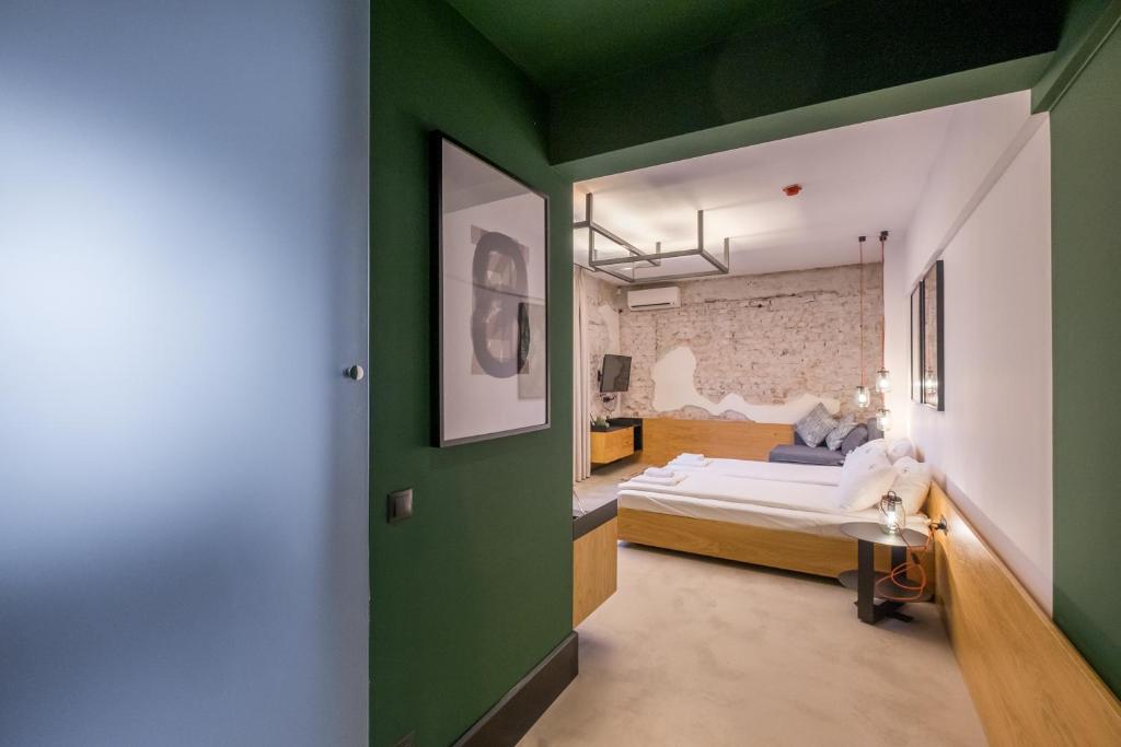 Postel nebo postele na pokoji v ubytování R34 Boutique Hotel