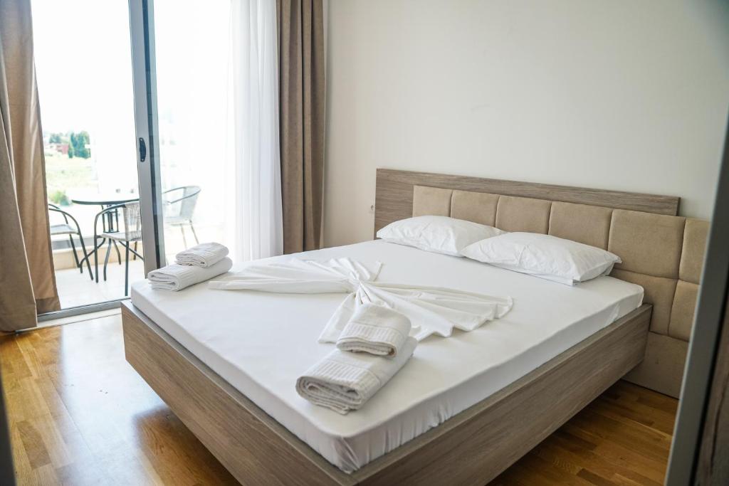 Postel nebo postele na pokoji v ubytování La Dolce Vita Residence