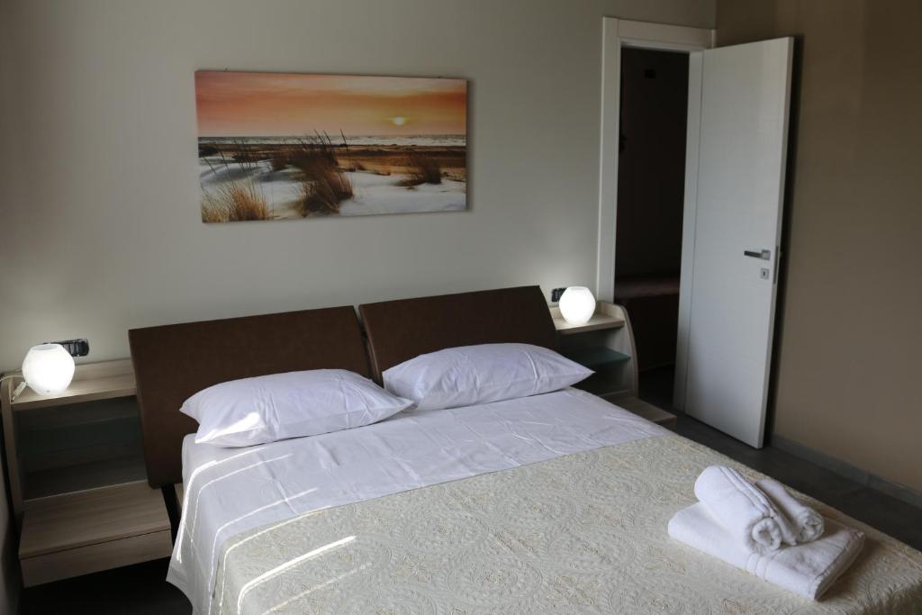Łóżko lub łóżka w pokoju w obiekcie B&B A CASA DI ZIA LUISA