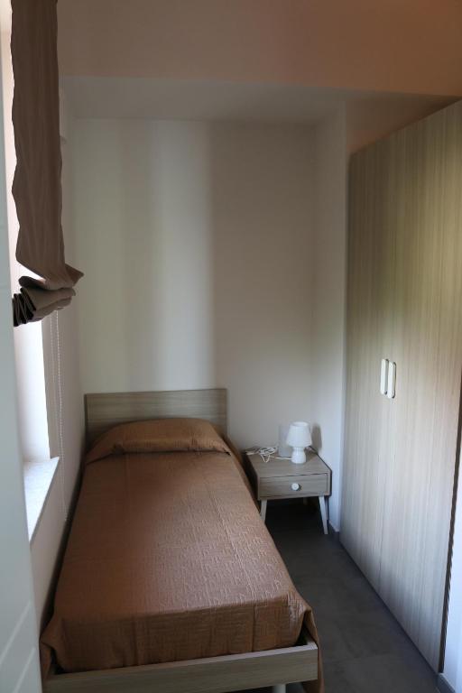 Łóżko lub łóżka w pokoju w obiekcie B&B A CASA DI ZIA LUISA