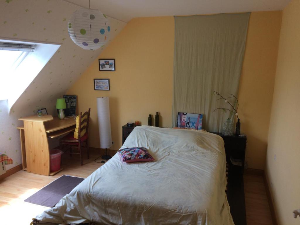 Postel nebo postele na pokoji v ubytování aux 2 oies