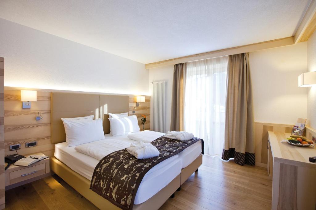 Posteľ alebo postele v izbe v ubytovaní Rio Stava Family Resort & Spa