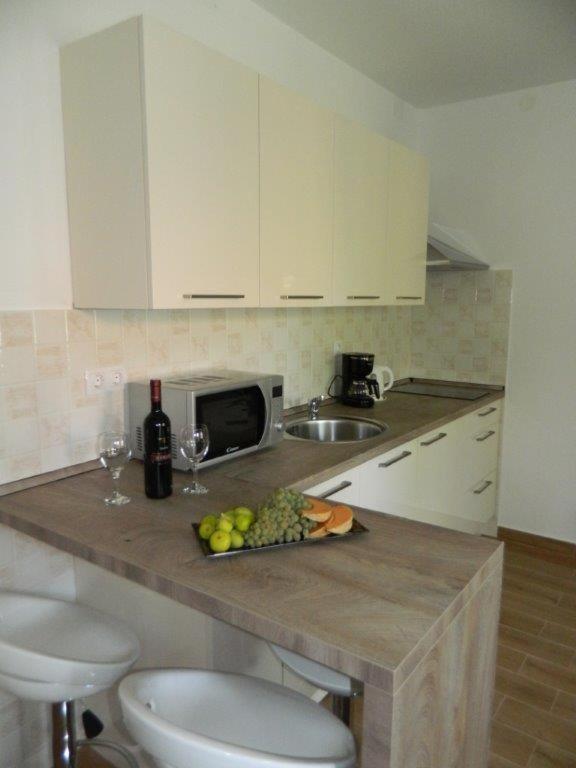 Kuchyň nebo kuchyňský kout v ubytování Apartments M&B