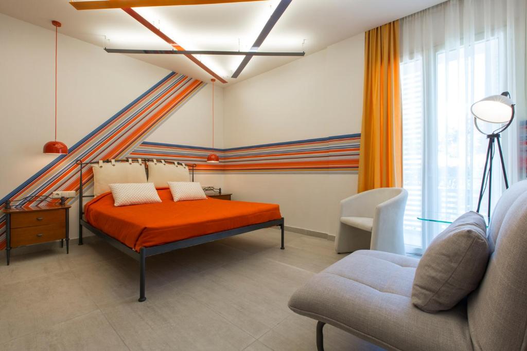 Postel nebo postele na pokoji v ubytování Flisvos Royal Hotel & Suites