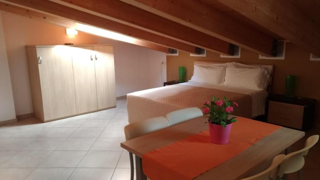 Łóżko lub łóżka w pokoju w obiekcie Residence Ilario Suite Hotel