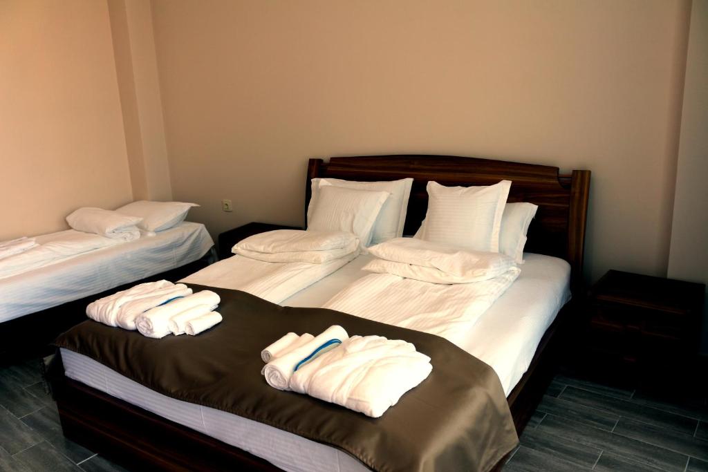 Postel nebo postele na pokoji v ubytování Hotel Lazi