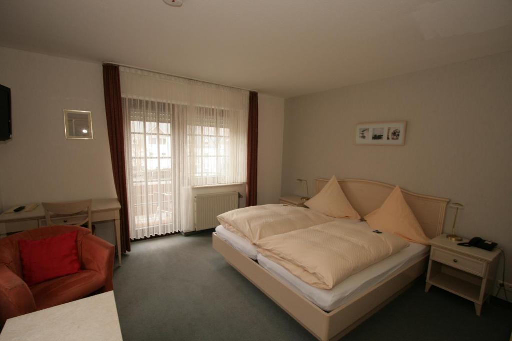 Postel nebo postele na pokoji v ubytování Hotel Ännchen