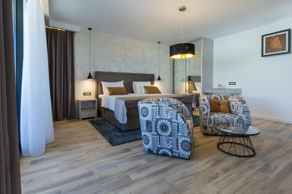 Posteľ alebo postele v izbe v ubytovaní Mirabilis Residence