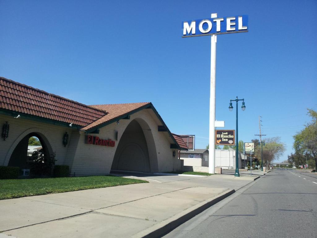 a motel sign on the side of a street at El Rancho Motel Lodi in Lodi