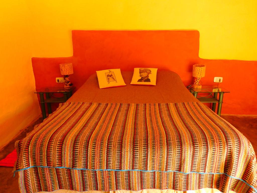 Postel nebo postele na pokoji v ubytování Hostel La Humahuacasa