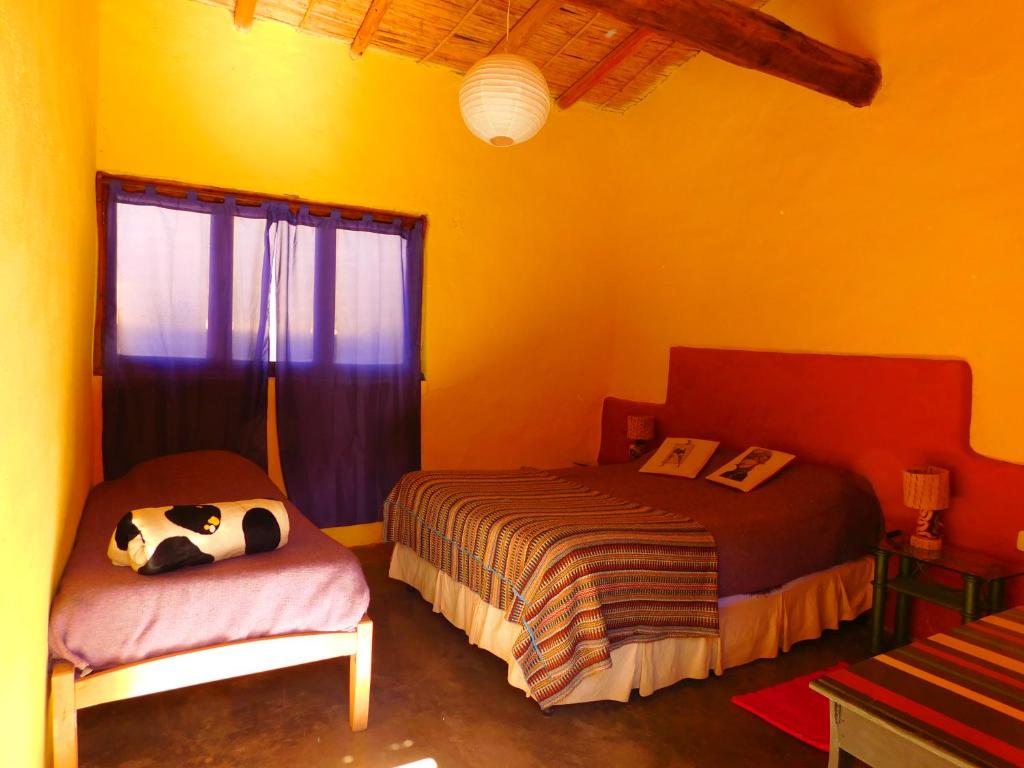 Postel nebo postele na pokoji v ubytování Hostel La Humahuacasa