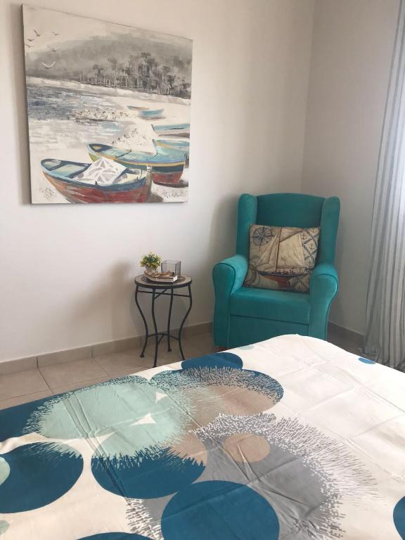 A bed or beds in a room at El Roquito Ocean View