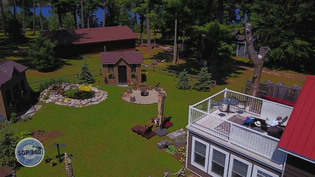 a model of a backyard with a house at Four Ninety Muskoka B & B in Gravenhurst