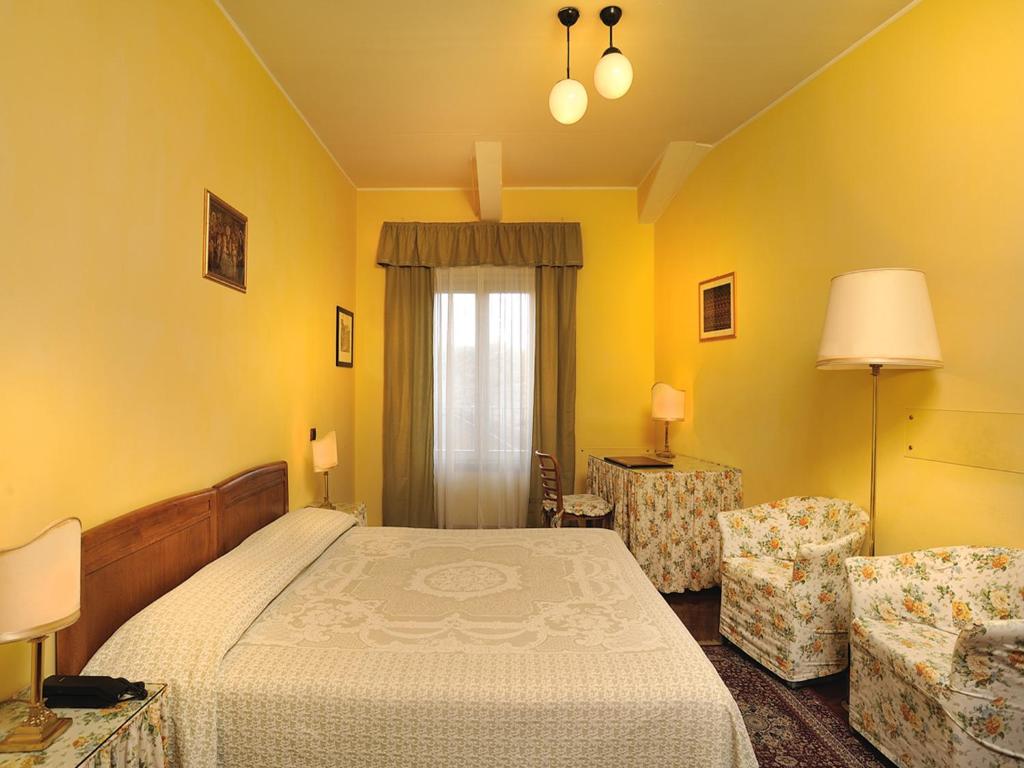 Postel nebo postele na pokoji v ubytování Albergo San Domenico