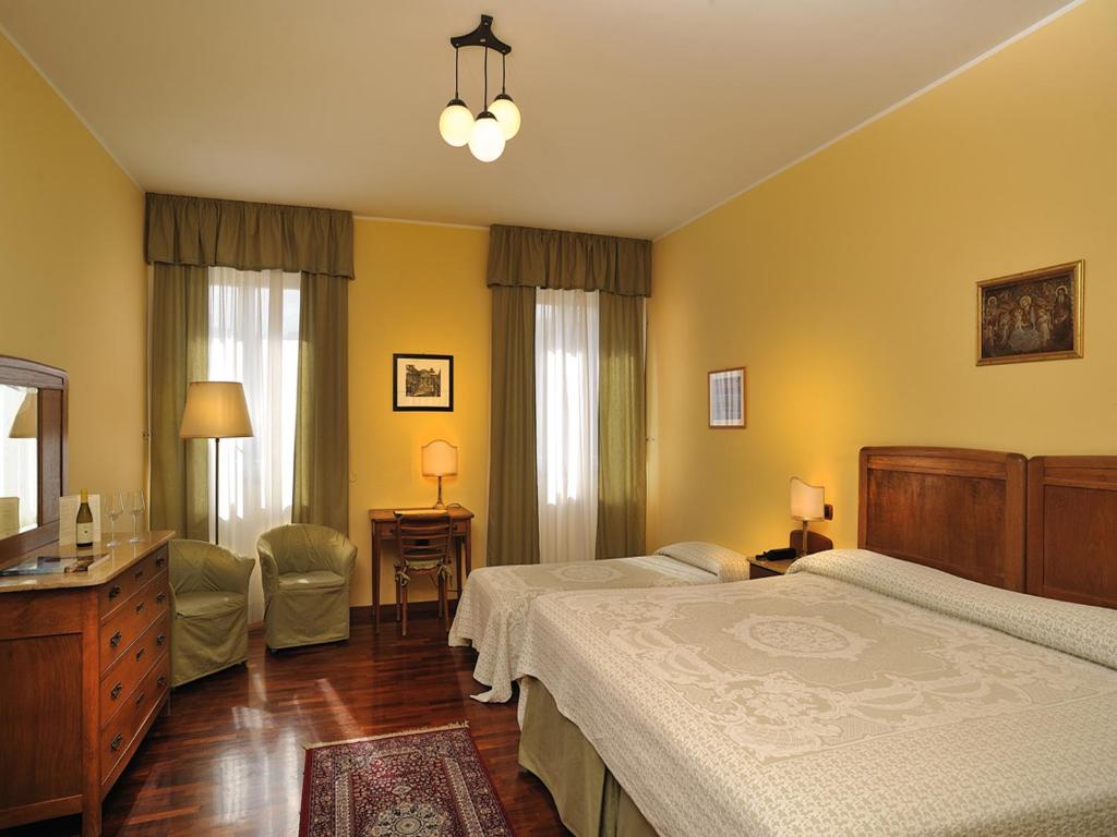 Postel nebo postele na pokoji v ubytování Albergo San Domenico