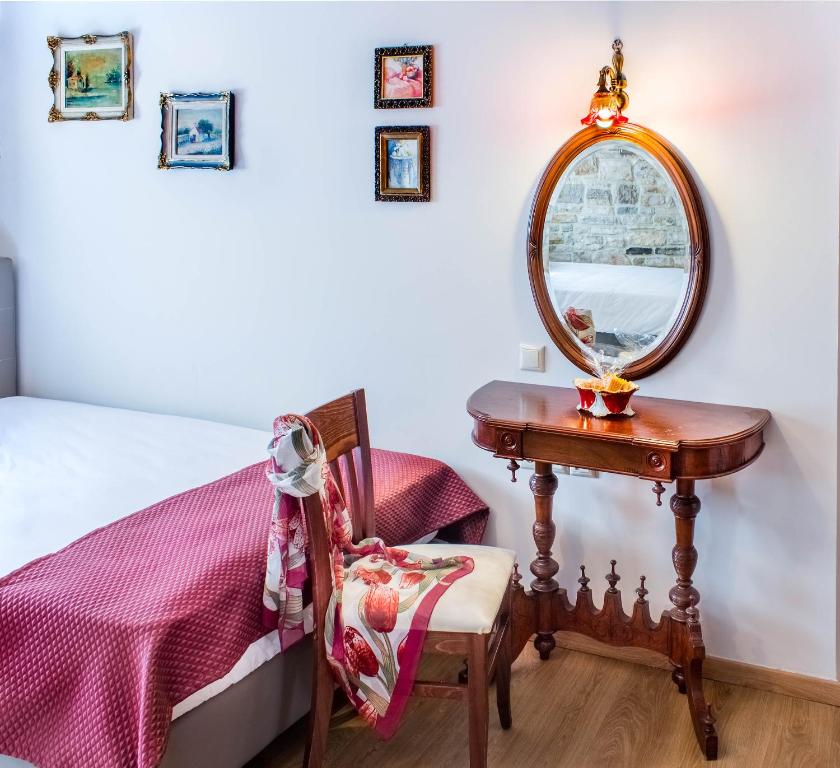 Postel nebo postele na pokoji v ubytování Gioraldi Art Hotel