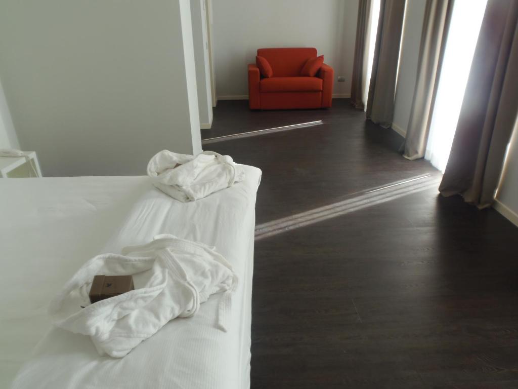Postel nebo postele na pokoji v ubytování Albergo Dongo