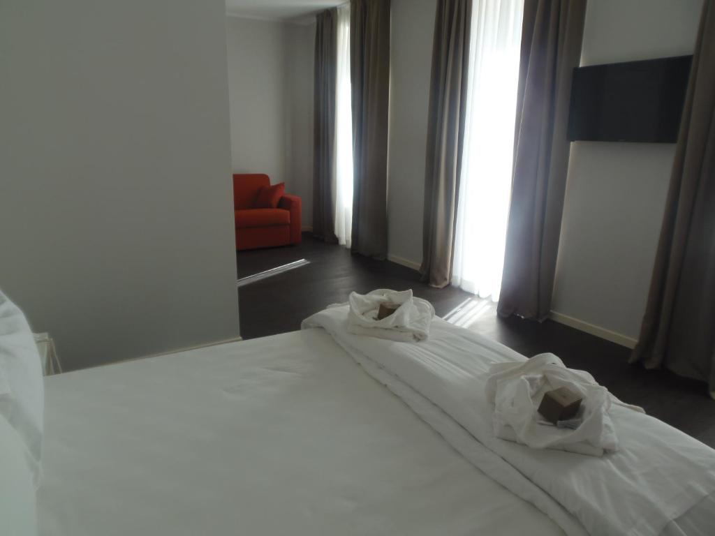 Postel nebo postele na pokoji v ubytování Albergo Dongo