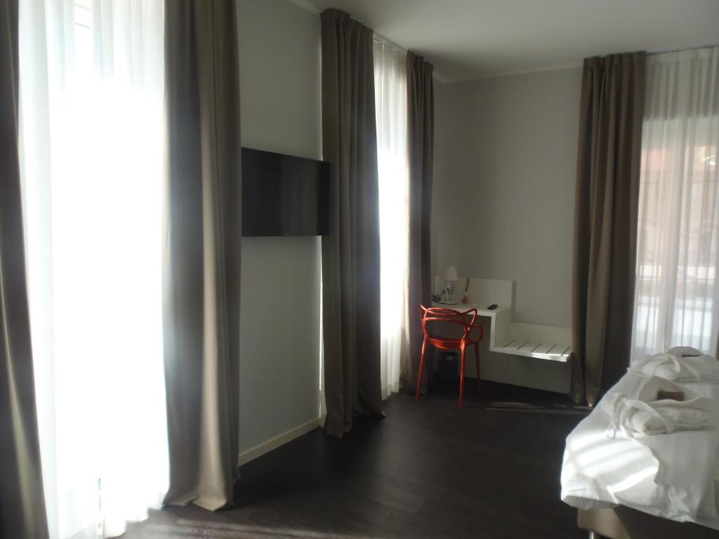 Postel nebo postele na pokoji v ubytování Albergo Dongo