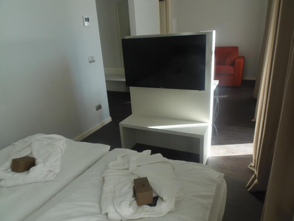 Postel nebo postele na pokoji v ubytování Albergo Dongo