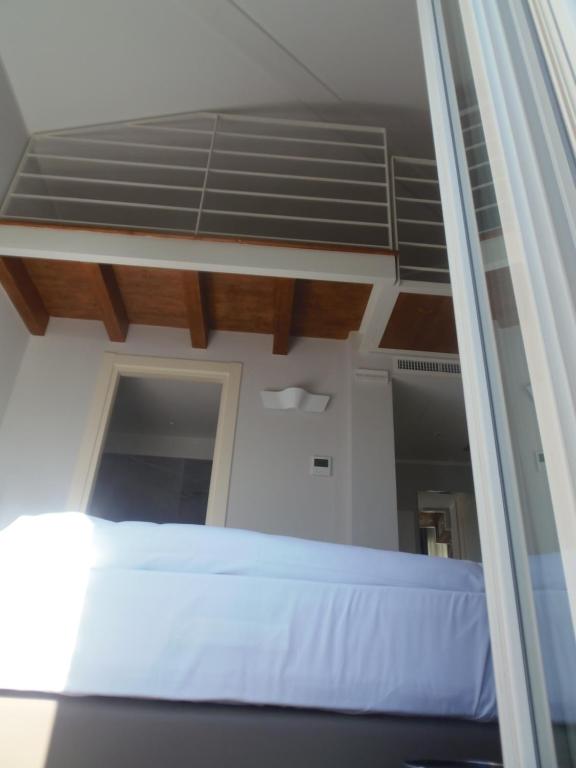 Postel nebo postele na pokoji v ubytování Albergo Dongo